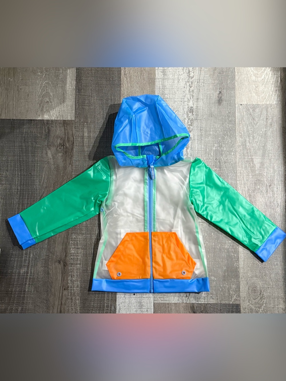Kids Clear Hooded Rain Jacket with Green Sleeves and Orange Pocket